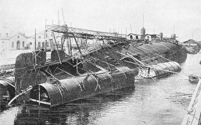A remarkable picture of the inverted battleship Leonardo da Vinci safely brought to dock in September, 1919