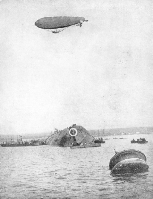 A striking illustration of the men on the bottom of the upturned battleship, Leonardo da Vinci, on January 24 1921