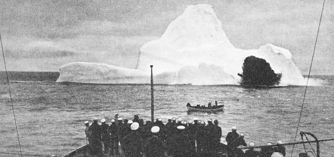 The crew of an Ice Patrol cutter watches the effect of high explosives on a floating mountain of ice