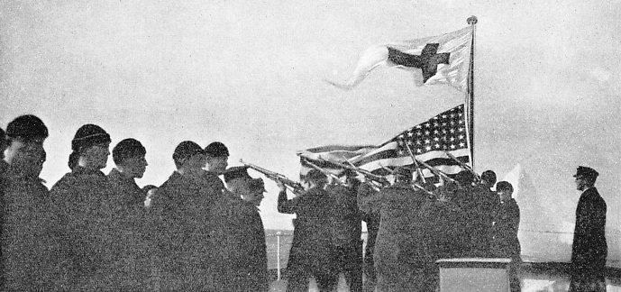 Members of the crew of an International Ice Patrol coast-guard cutter firing a salute in memory of the 1,498 lives lost in the Titanic disaster
