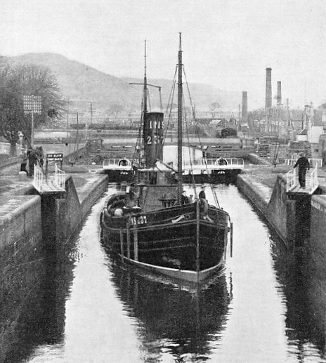 AN INVERNESS DRIFTER, the Invernairne, passing through the locks at Inverness