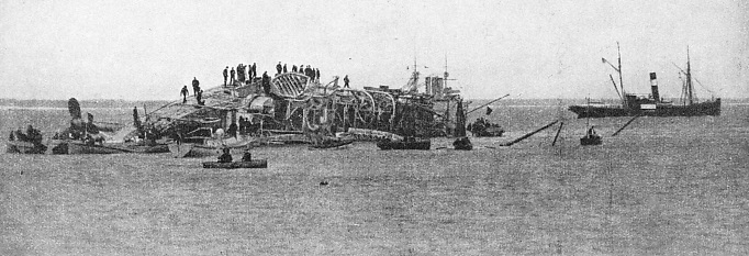 The Gladiator, a 6,000-tons warship, lying on her side