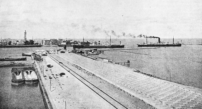 THE ENTRANCE TO THE HARBOUR at Port Said with Port Fuad in the foreground