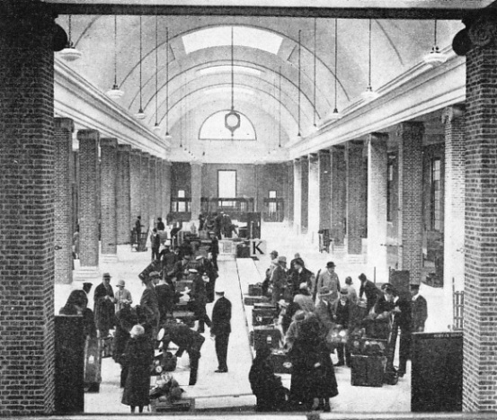 AT TILBURY the baggage of passengers from incoming liners is examined in a spacious new building