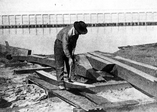 HARRY PIDGEON HEWING OUT KEEL TIMBERS for the Islander