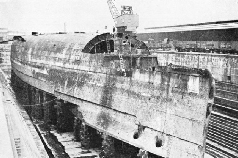 UPSIDE DOWN IN DRY DOCK. The German battleship Konig Albert at Rosyth