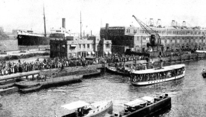 ADMIRING CROWDS THRONG THE BANKS at Amsterdam