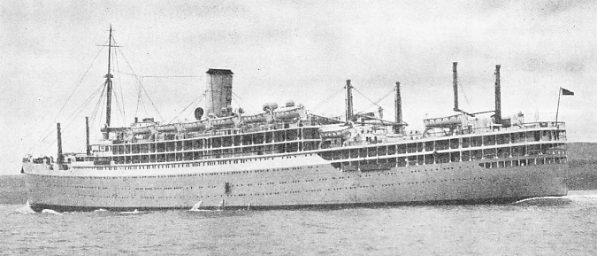 THE CORN-COLOURED HULL of the Orion, with her raked stem and cruiser stern