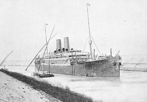 A PASSENGER LINER in the Suez Canal passing a native dhow