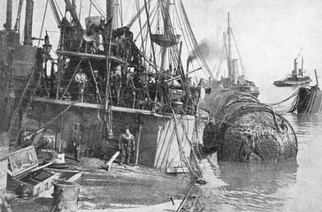 A view of the Gladiator after she had been raised by tugs and pontoons